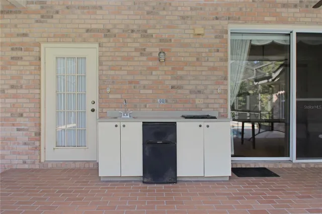 a view of a swimming pool with a patio