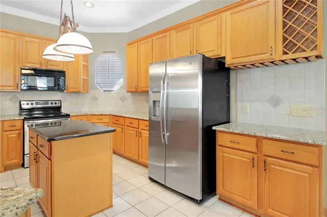 a utility room with cabinets washer and dryer