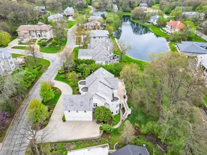 an aerial view of residential house with outdoor space and street view
