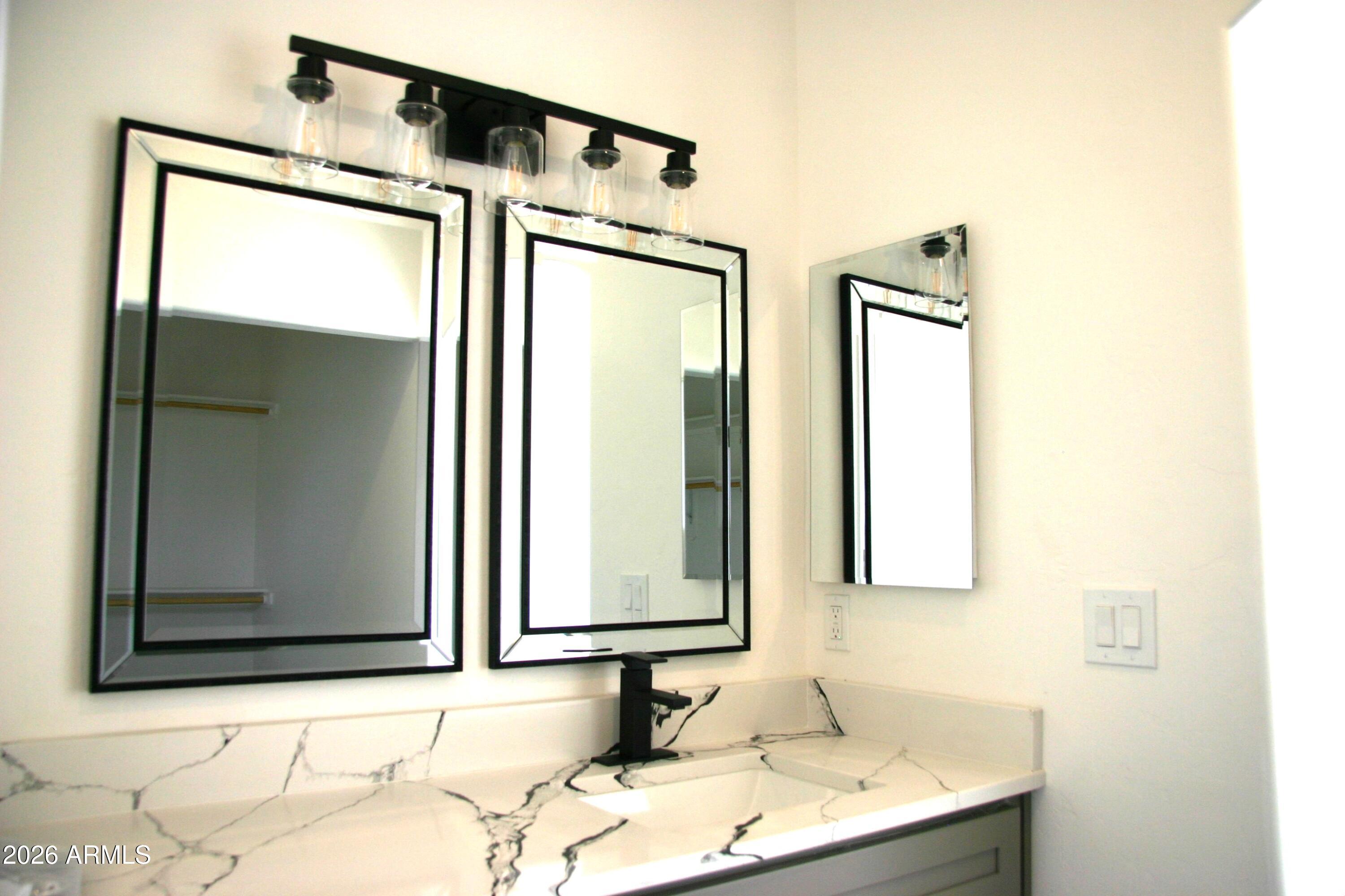 6370 South Jaxel Road Hereford, AZ 85615 - Photo 34 of 58 a bathroom with a sink and a mirror