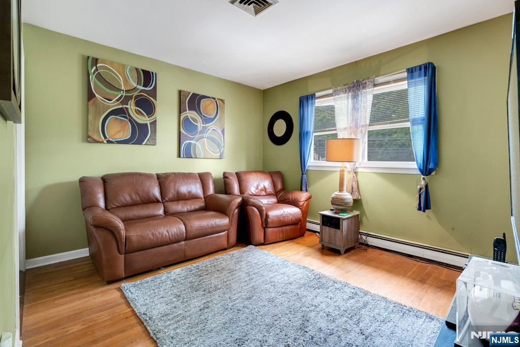 185 Ratzer Road Wayne, NJ 07470 - Photo 24 of 36 a living room with furniture and a window