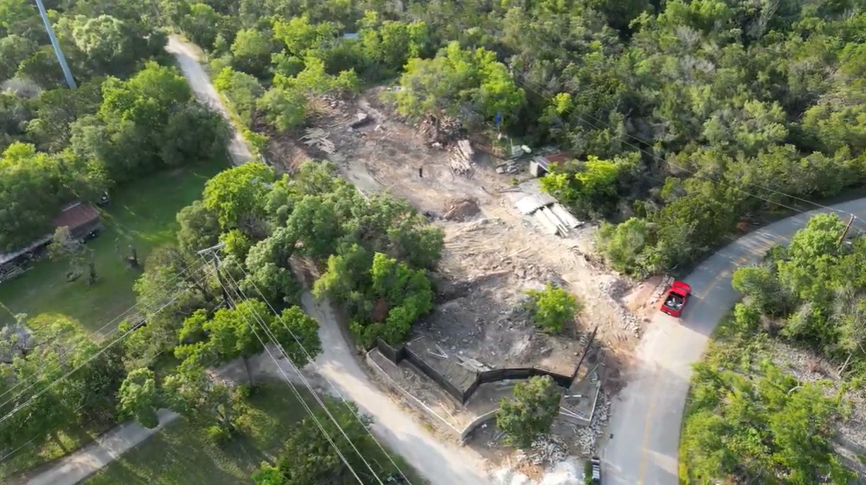 12015 Buckner Road Austin, TX 78726 - Photo 14 of 22 An aerial perspective showcases a rural property amidst verdant foliage, with clear potential for development.