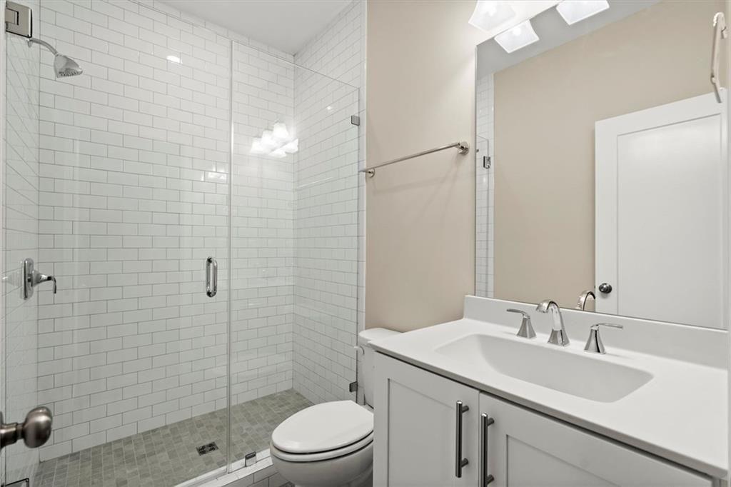 293 Thompson Street Alpharetta, GA 30009 - Photo 48 of 71 a bathroom with a sink a toilet and shower