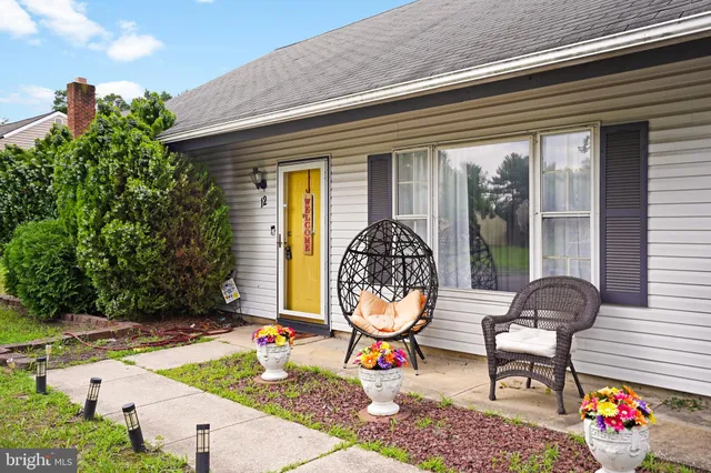 a front view of house with outdoor seating