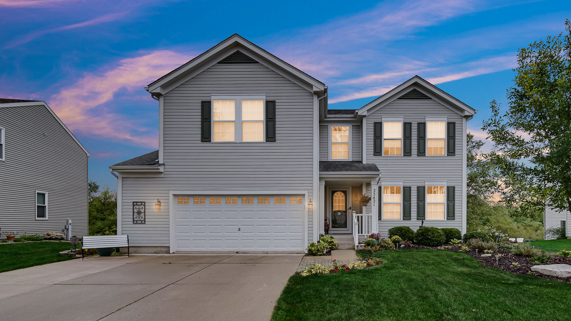 25421 Faraday Road Manhattan, IL 60442 - Photo 2 of 36 a front view of a house with a yard and garage