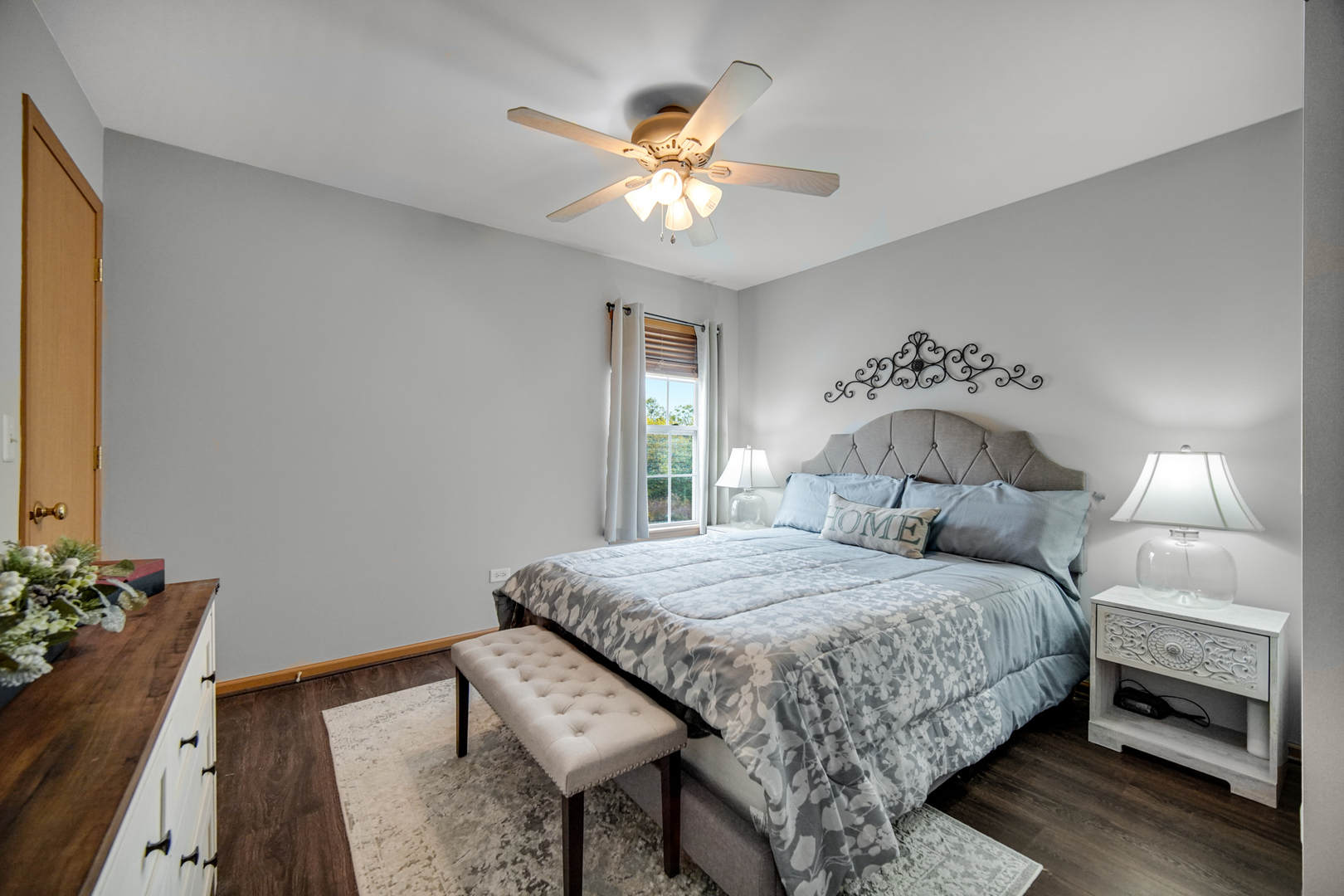 25421 Faraday Road Manhattan, IL 60442 - Photo 26 of 36 a bedroom with a bed and a chandelier