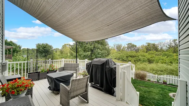 a view of roof deck with furniture