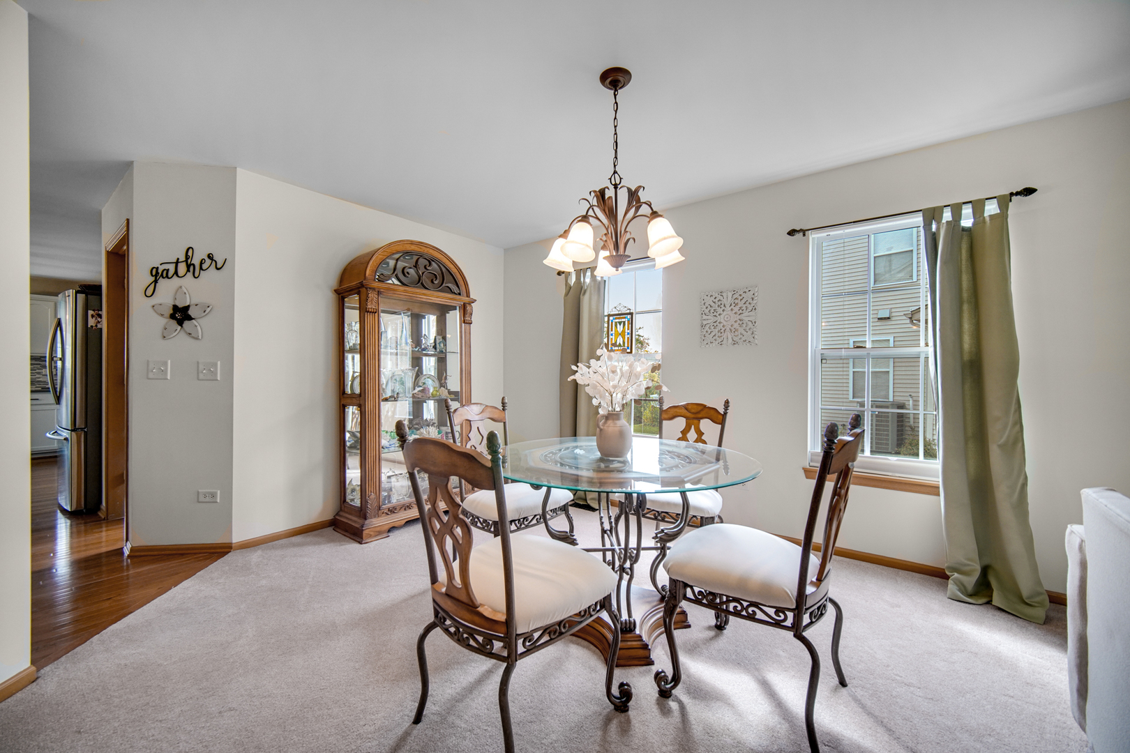 25421 Faraday Road Manhattan, IL 60442 - Photo 5 of 36 a view of a dining room with furniture and chandelier