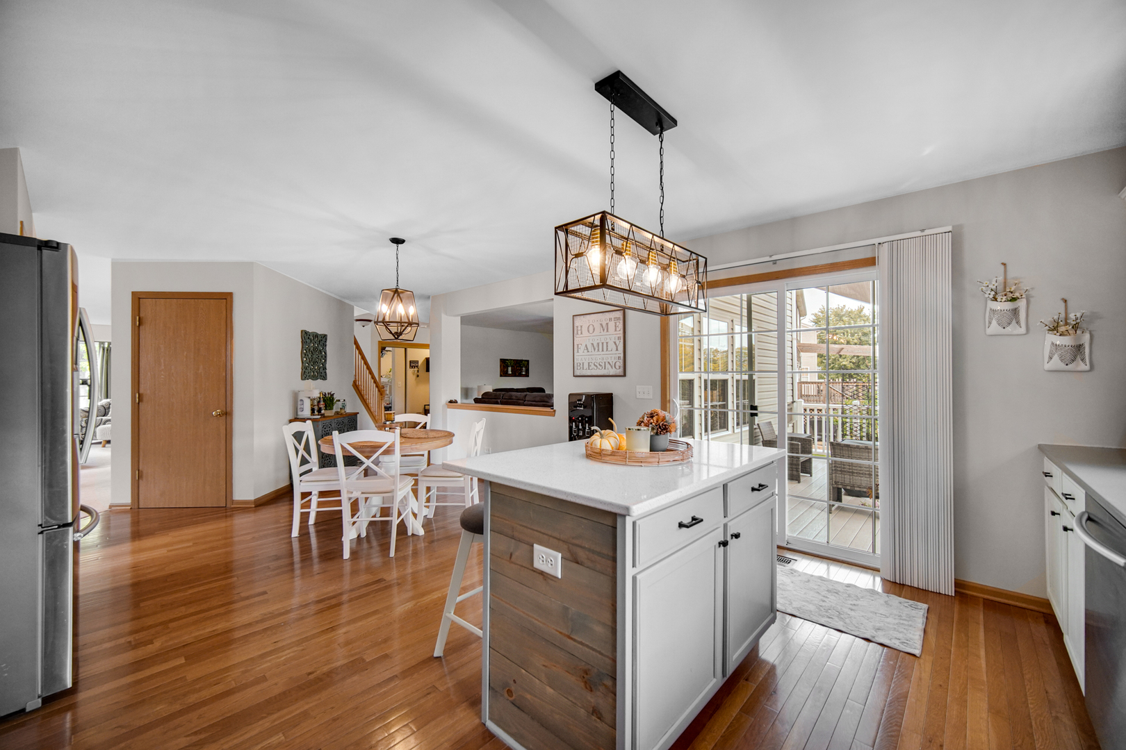 25421 Faraday Road Manhattan, IL 60442 - Photo 8 of 36 a view of a dining room with furniture window and wooden floor