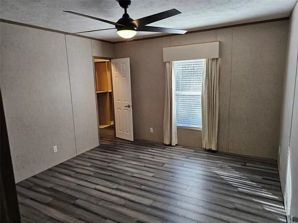 a view of a livingroom with wooden floor