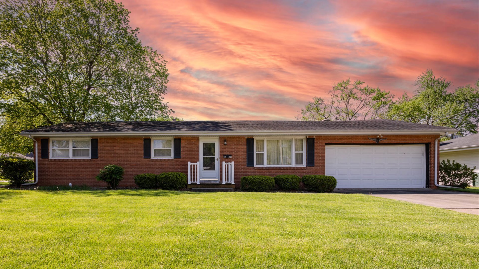 front view of a house with a yard