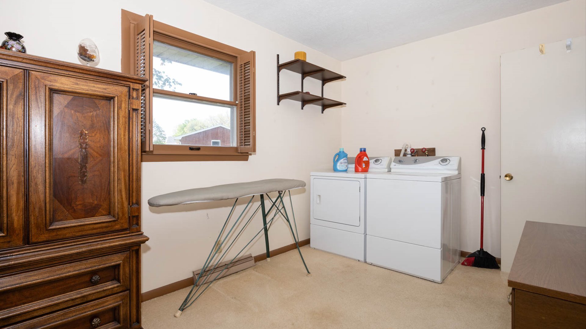 1209 Spear Drive Normal, IL 61761 - Photo 16 of 31 a view of a hallway to closet and cabinet