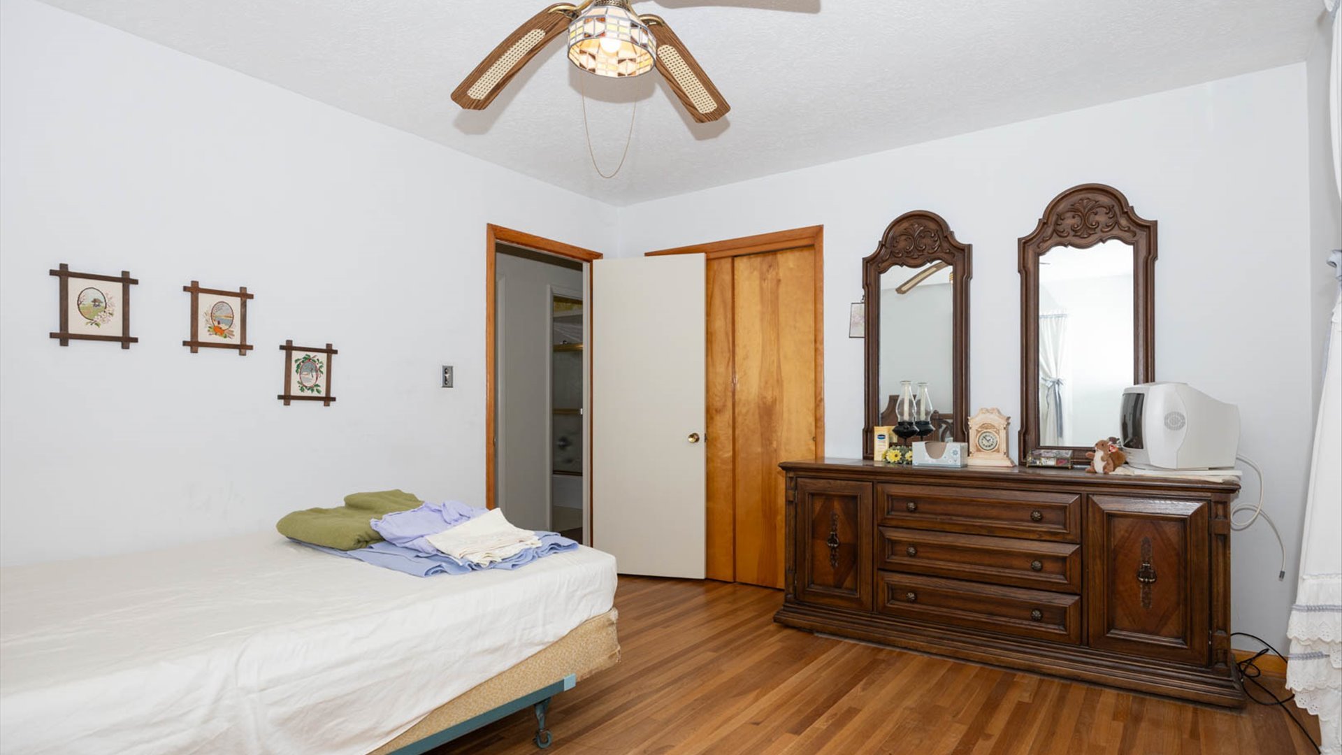 1209 Spear Drive Normal, IL 61761 - Photo 18 of 31 a bedroom with a bed and a chandelier