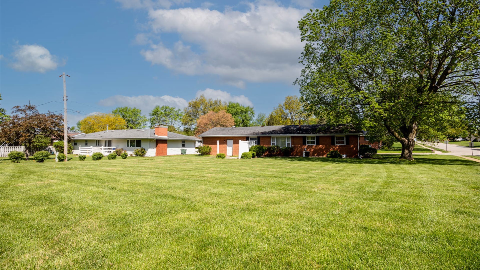 1209 Spear Drive Normal, IL 61761 - Photo 25 of 31 a view of a house with a big yard and large trees