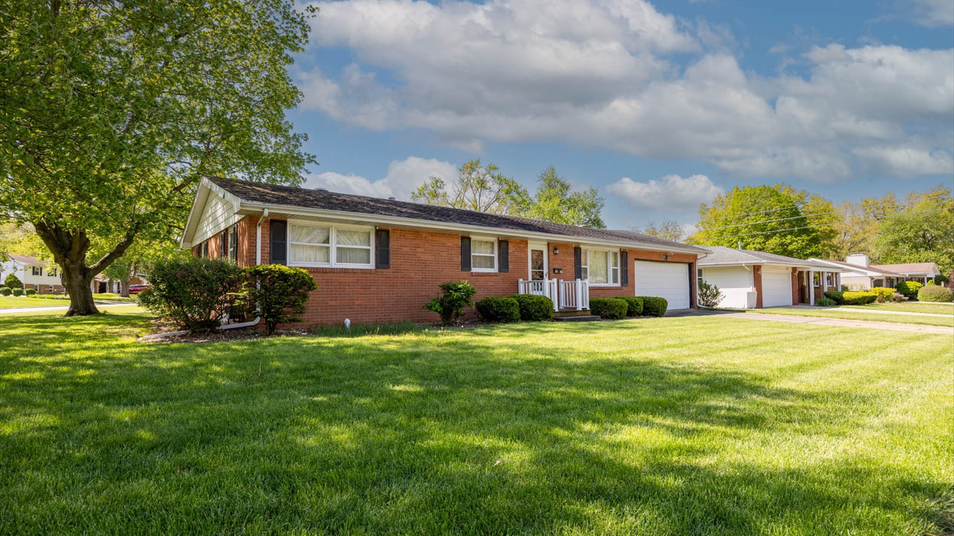 1209 Spear Drive Normal, IL 61761 - Photo 30 of 31 a front view of a house with a garden