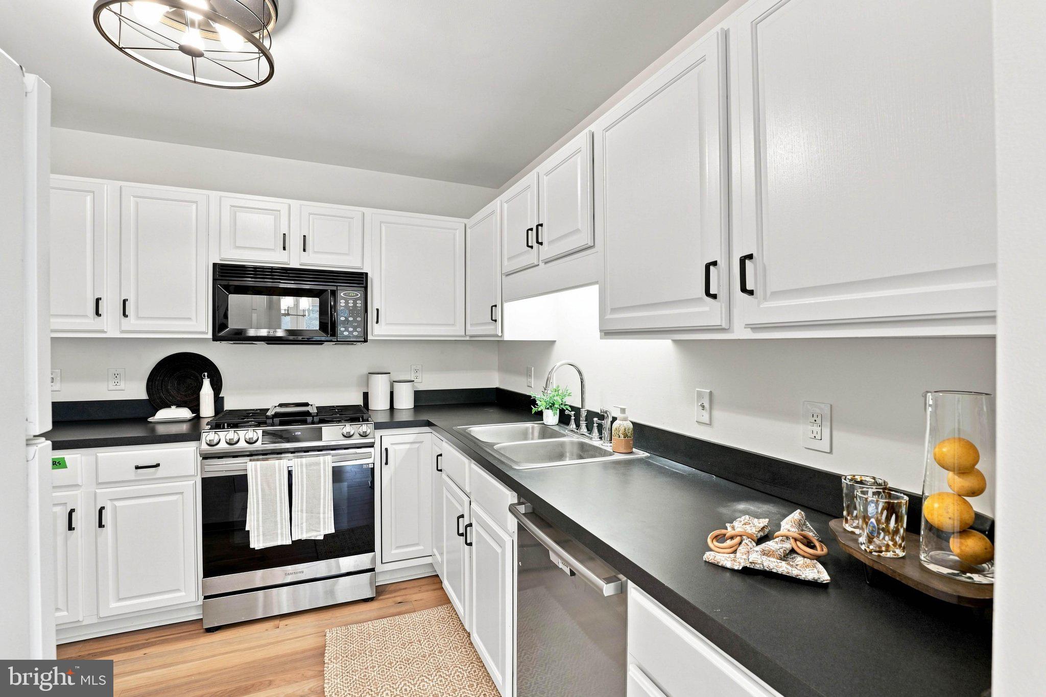 366 Crosswinds Drive Lititz, PA 17543 - Photo 4 of 35 Modern kitchen with sleek white cabinetry.