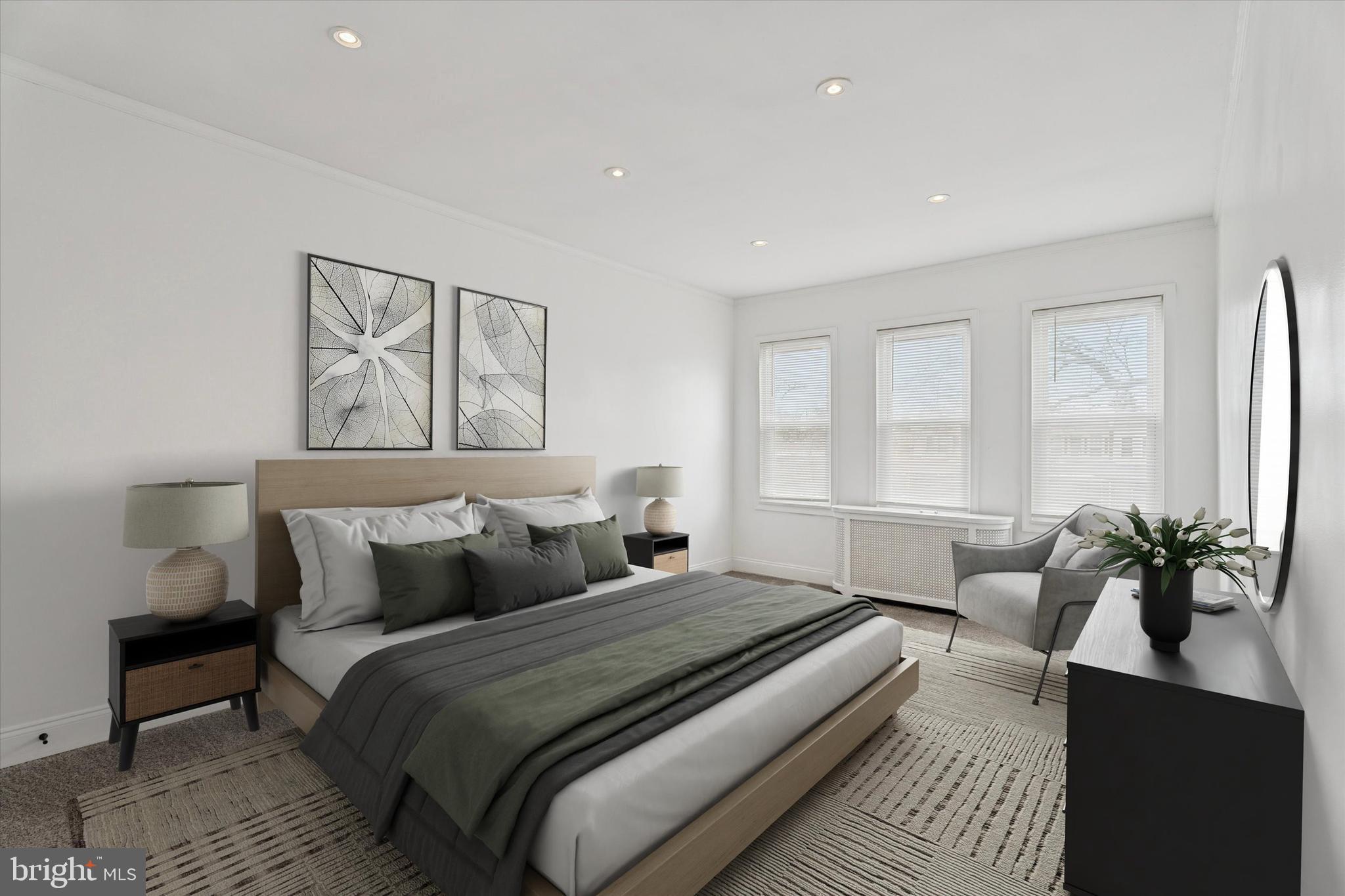 320 East Phil Ellena Street Philadelphia, PA 19119 - Photo 13 of 21 a bedroom with a large bed and windows