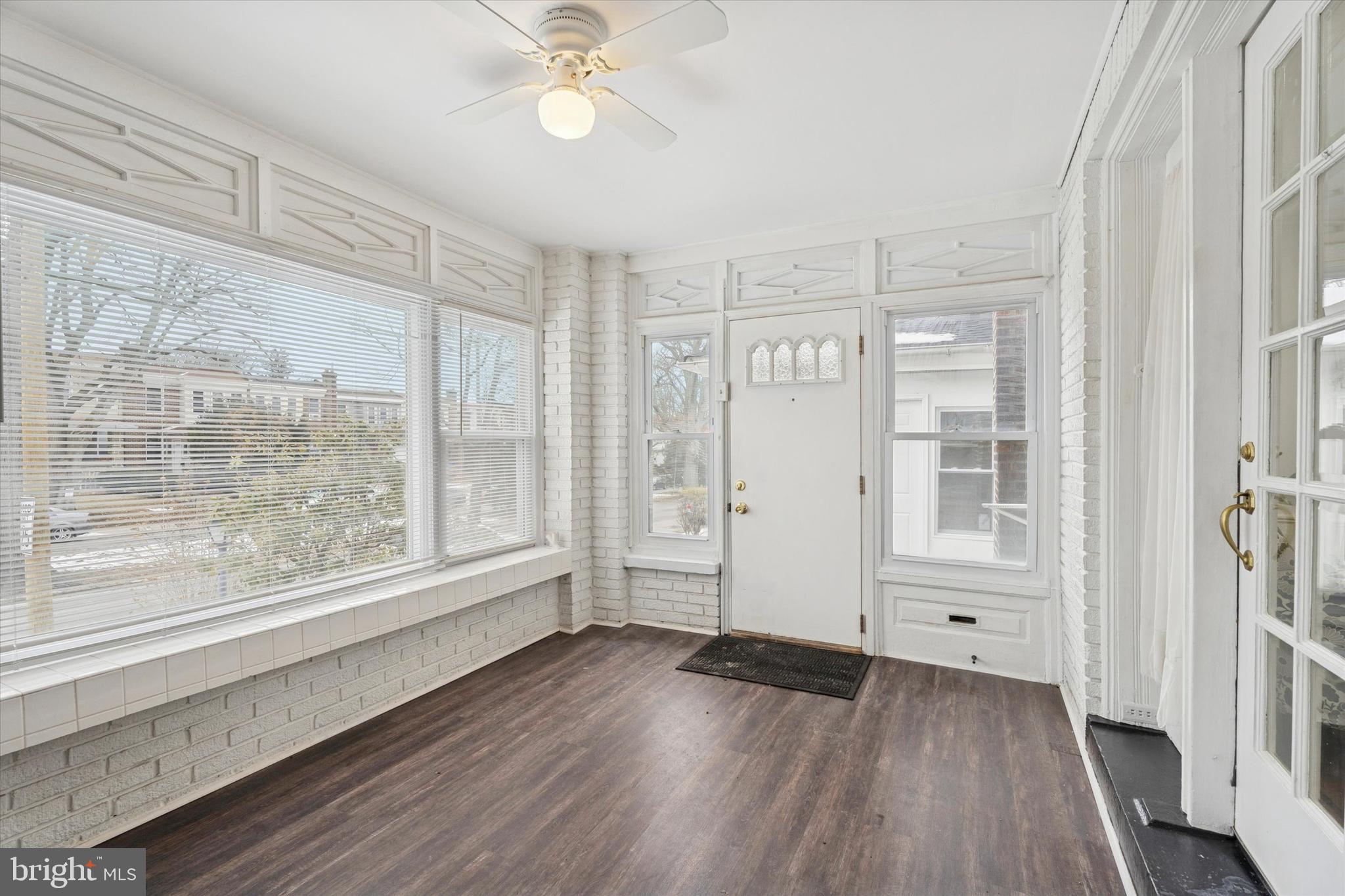320 East Phil Ellena Street Philadelphia, PA 19119 - Photo 3 of 21 a view of an empty room with wooden floor and a window
