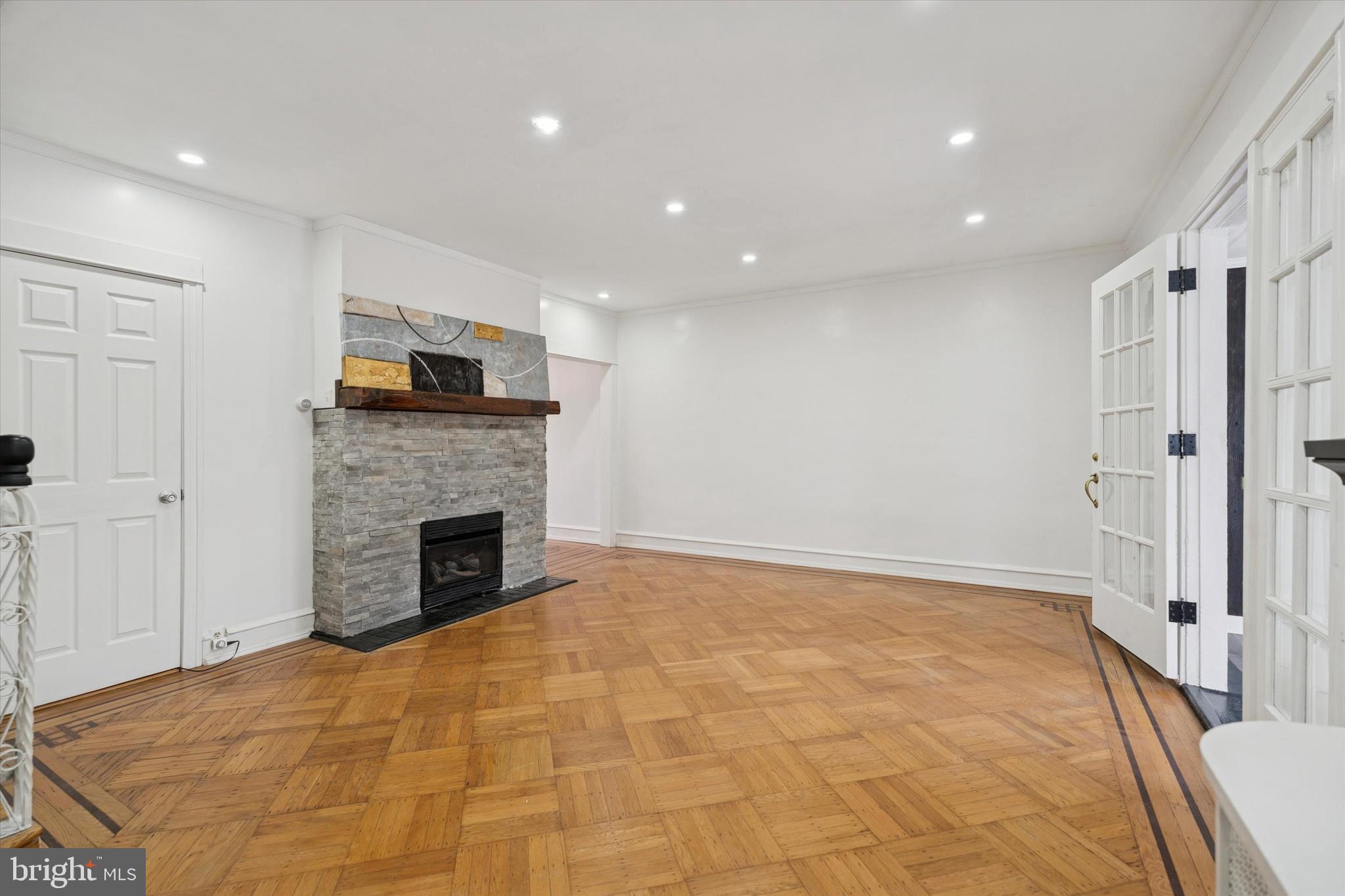 320 East Phil Ellena Street Philadelphia, PA 19119 - Photo 5 of 21 a view of an empty room with a fireplace