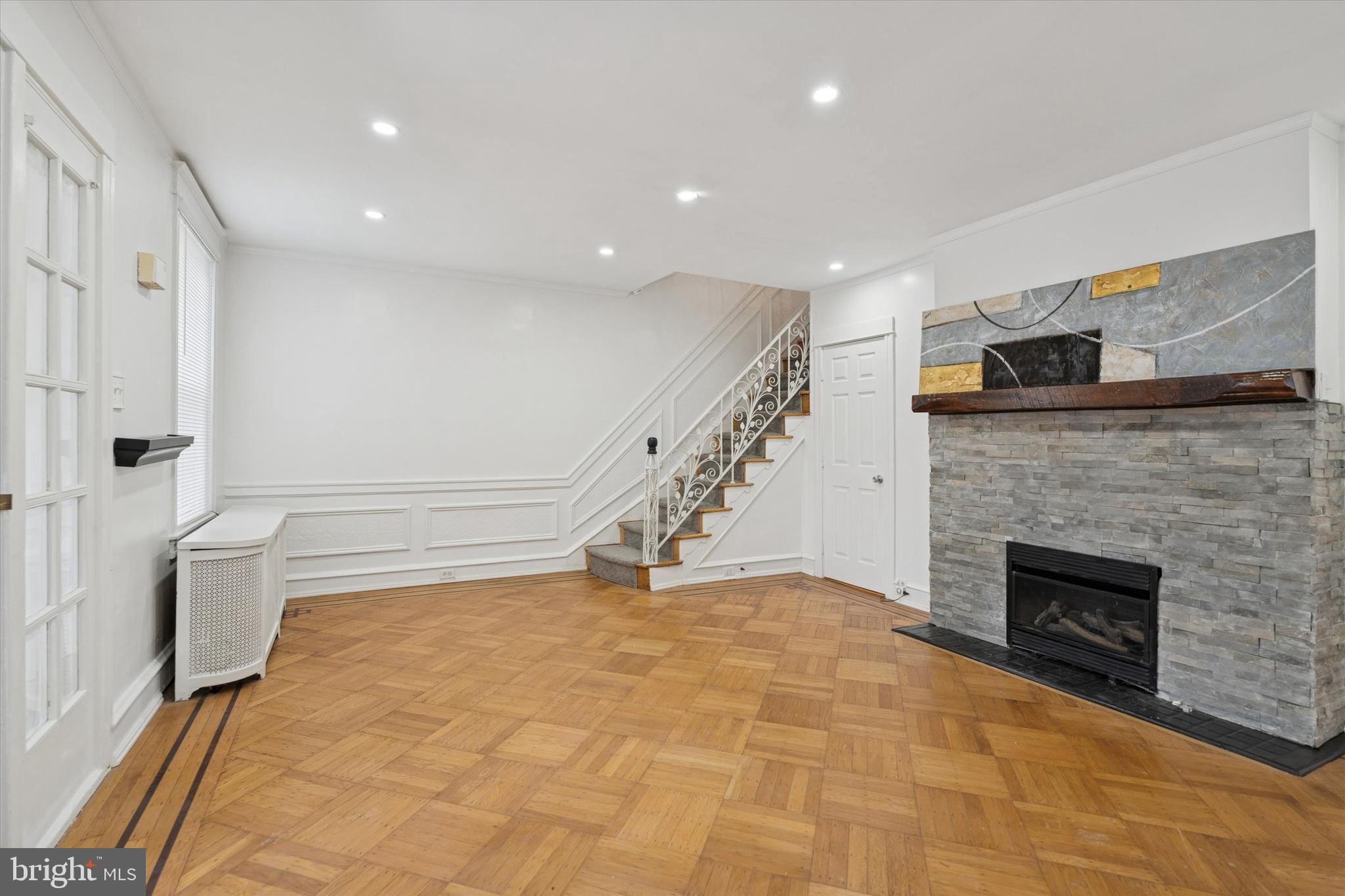 320 East Phil Ellena Street Philadelphia, PA 19119 - Photo 6 of 21 a view of an empty room with a fireplace
