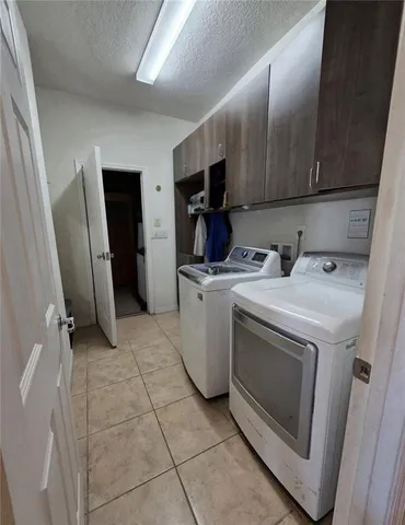 an empty room with a ceiling fan and window