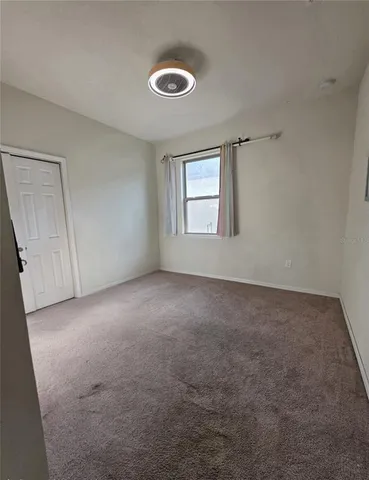 a bathroom with a toilet a sink and a mirror