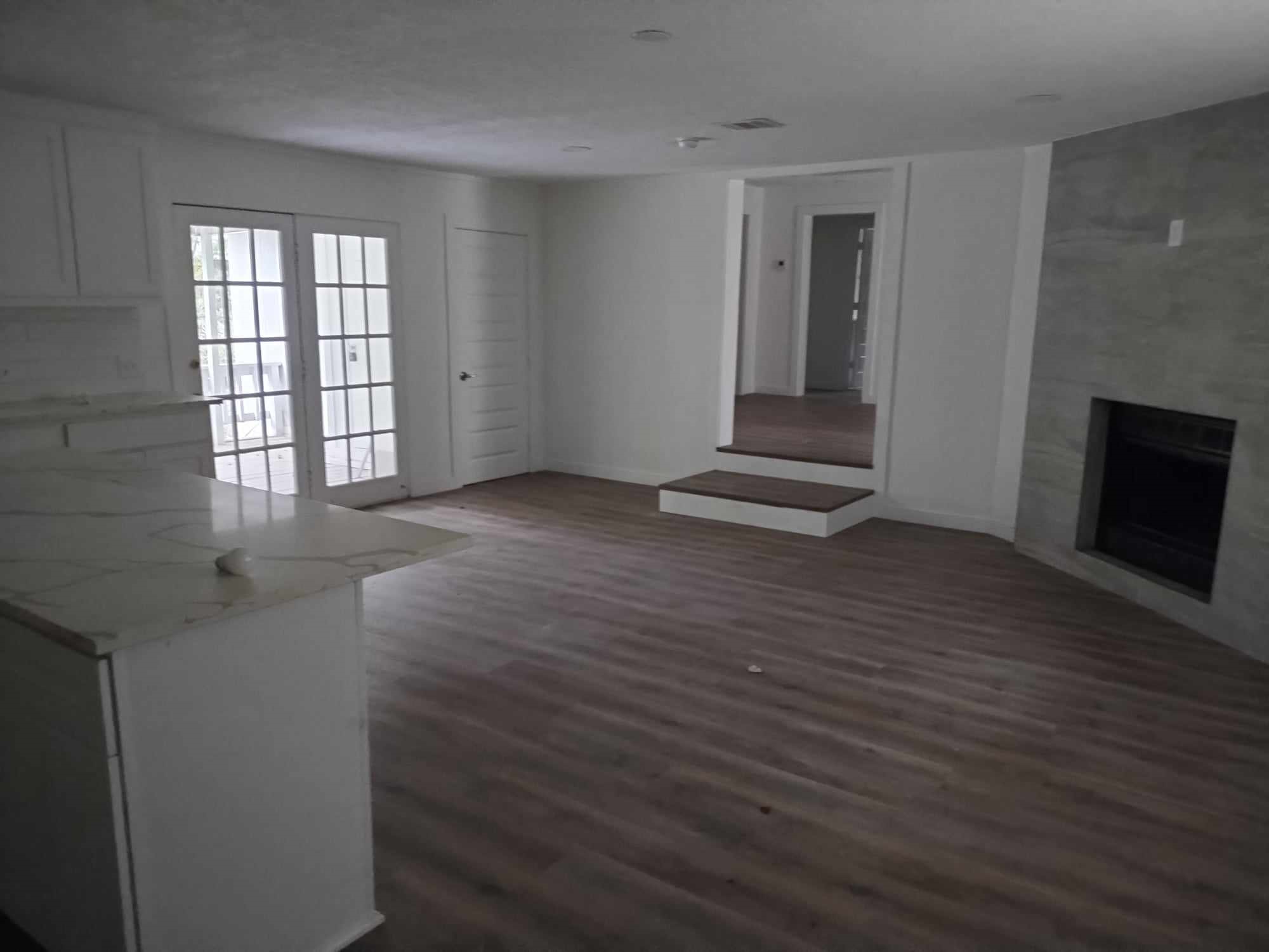 510 West Decatur Avenue Orange, TX 77630 - Photo 7 of 22 wooden floor in an empty room with a window