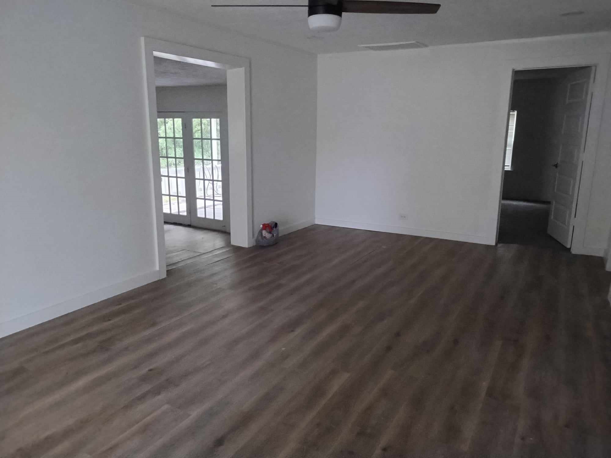 510 West Decatur Avenue Orange, TX 77630 - Photo 9 of 22 a view of an empty room with wooden floor and a window