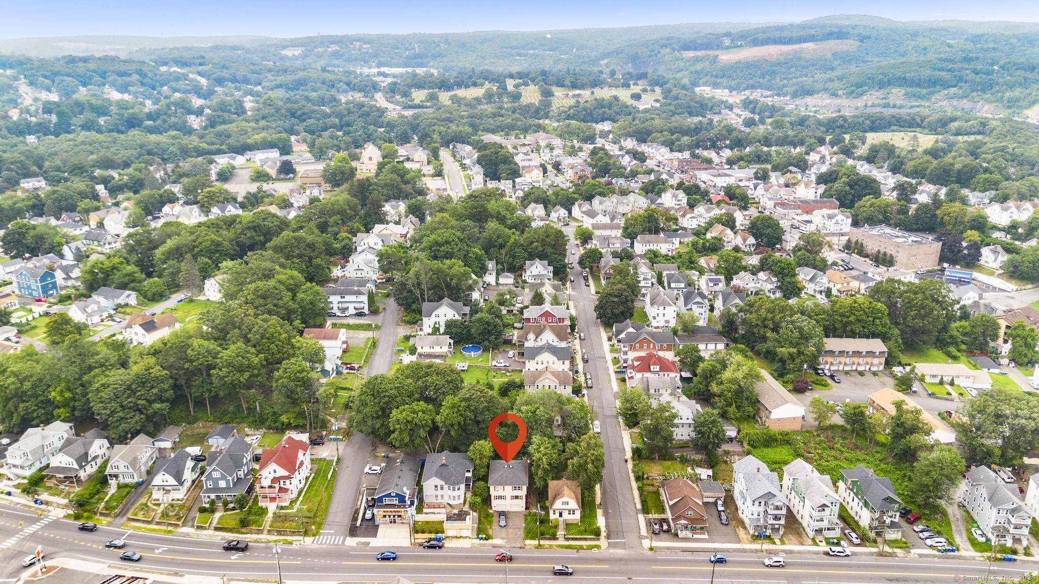 100 Meriden Road, Unit A Waterbury, CT 06705 - Photo 2 of 2 an aerial view of residential houses with outdoor space and street view