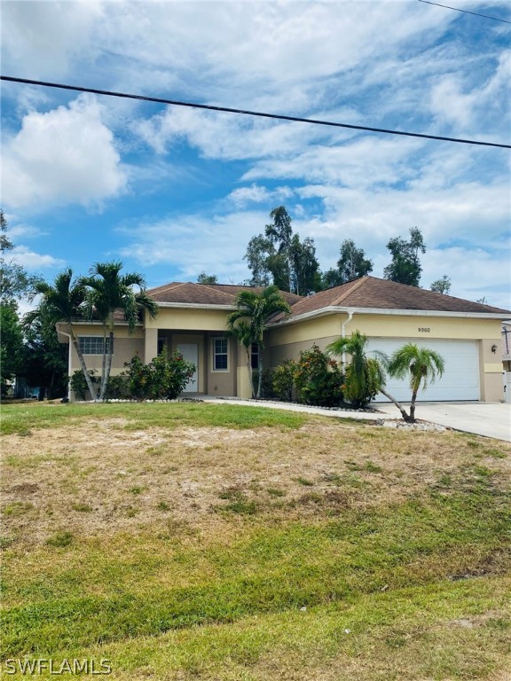 9060 Pineapple Road Fort Myers, FL 33967 - Photo 2 of 33 a view of a house with a yard and potted plants
