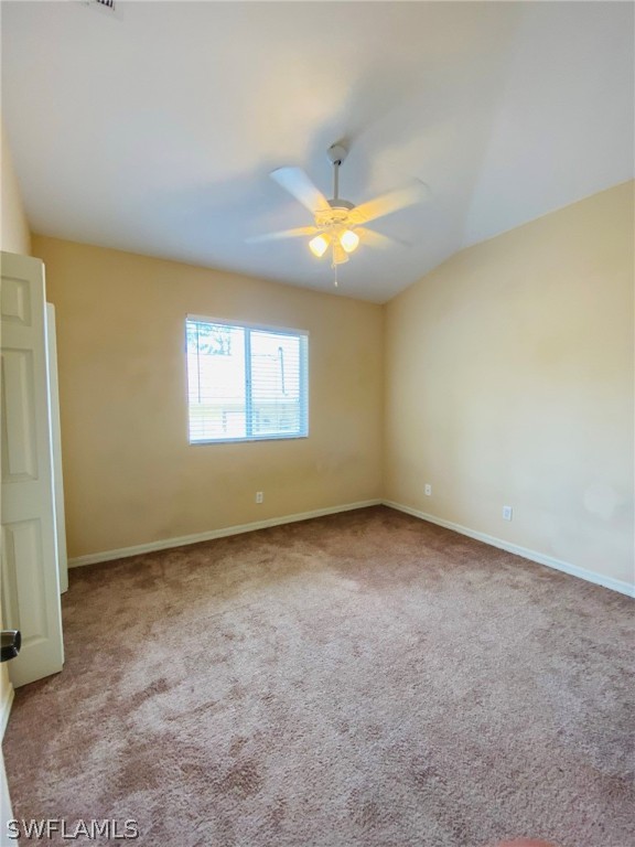 9060 Pineapple Road Fort Myers, FL 33967 - Photo 25 of 33 an empty room with a window and a fan
