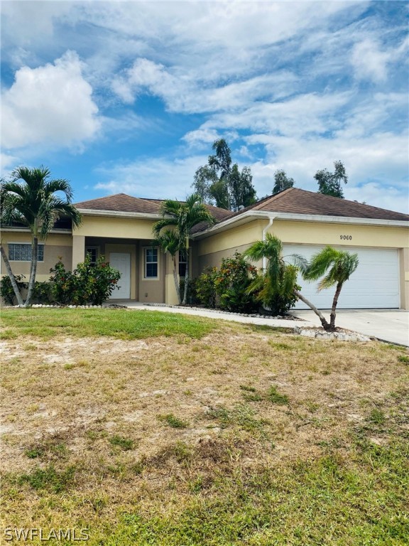 9060 Pineapple Road Fort Myers, FL 33967 - Photo 3 of 33 a view of a house with a yard and potted plants