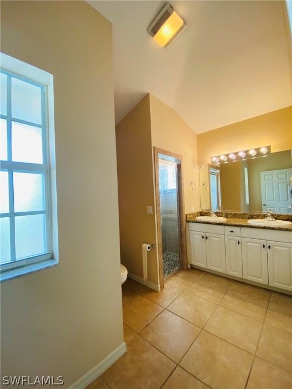 9060 Pineapple Road Fort Myers, FL 33967 - Photo 31 of 33 a large bathroom with a double vanity sink and a mirror
