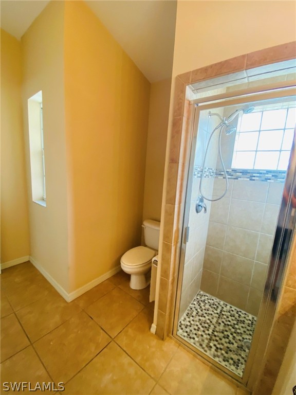 9060 Pineapple Road Fort Myers, FL 33967 - Photo 32 of 33 a bathroom with a granite countertop shower and a toilet