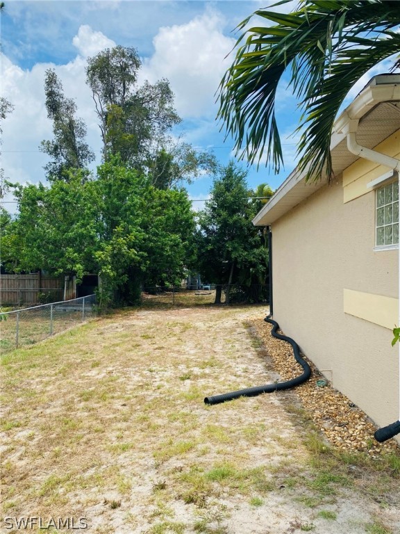 9060 Pineapple Road Fort Myers, FL 33967 - Photo 6 of 33 a view of backyard of a house