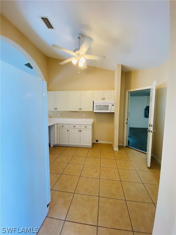 9060 Pineapple Road Fort Myers, FL 33967 - Photo 10 of 33 a view of a kitchen with a sink and a refrigerator