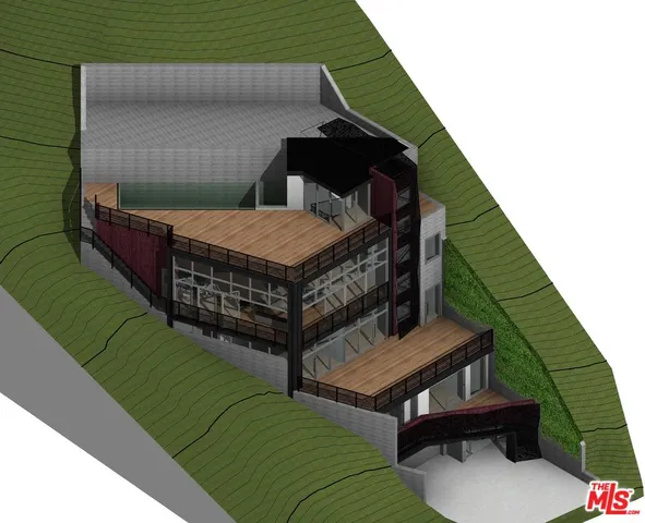 a view of a dry field with trees in the background