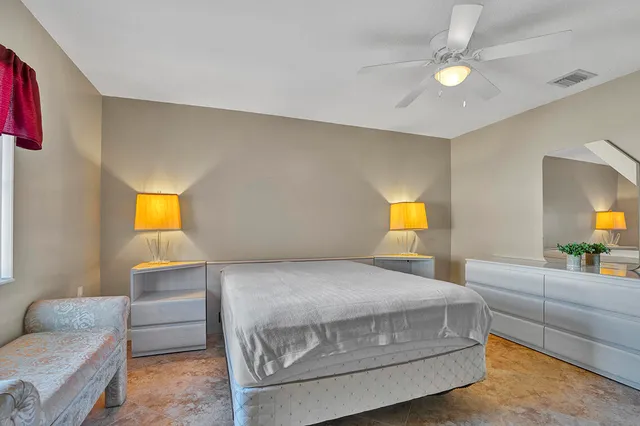 a bedroom with a bed and window