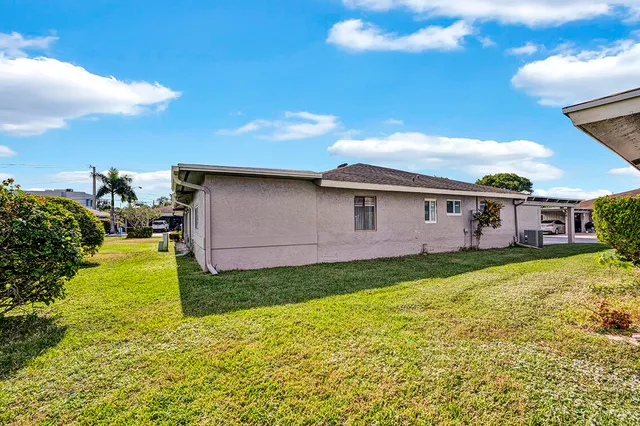 a view of a backyard with plants and a garden