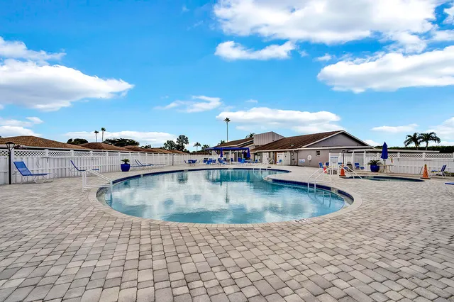 an aerial view of a house with a ocean view