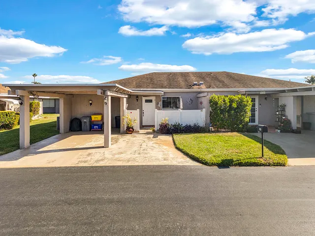 an aerial view of a house with a swimming pool