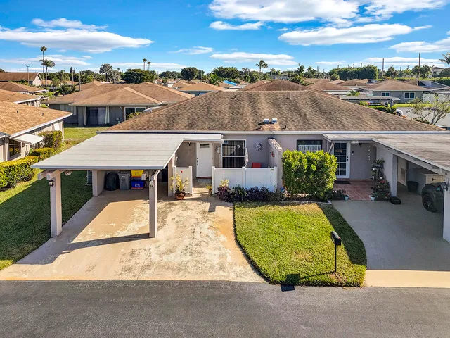 an aerial view of multiple houses with outdoor space