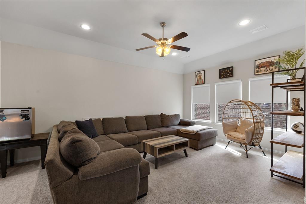 1806 Evening Star Road Frisco, TX 75033 - Photo 32 of 38 Living room featuring light colored carpet and ceiling fan