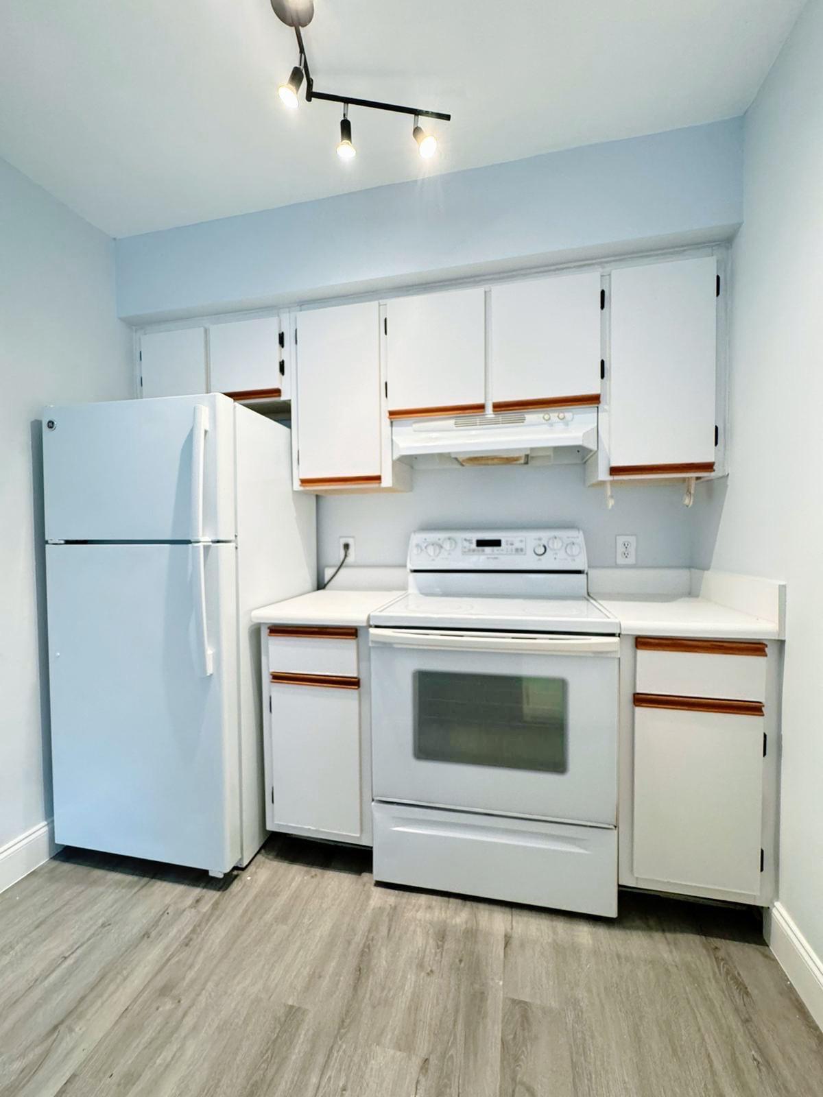 540 South Park Road Hollywood, FL 33021 - Photo 12 of 26 a kitchen with a white stove top oven and refrigerator