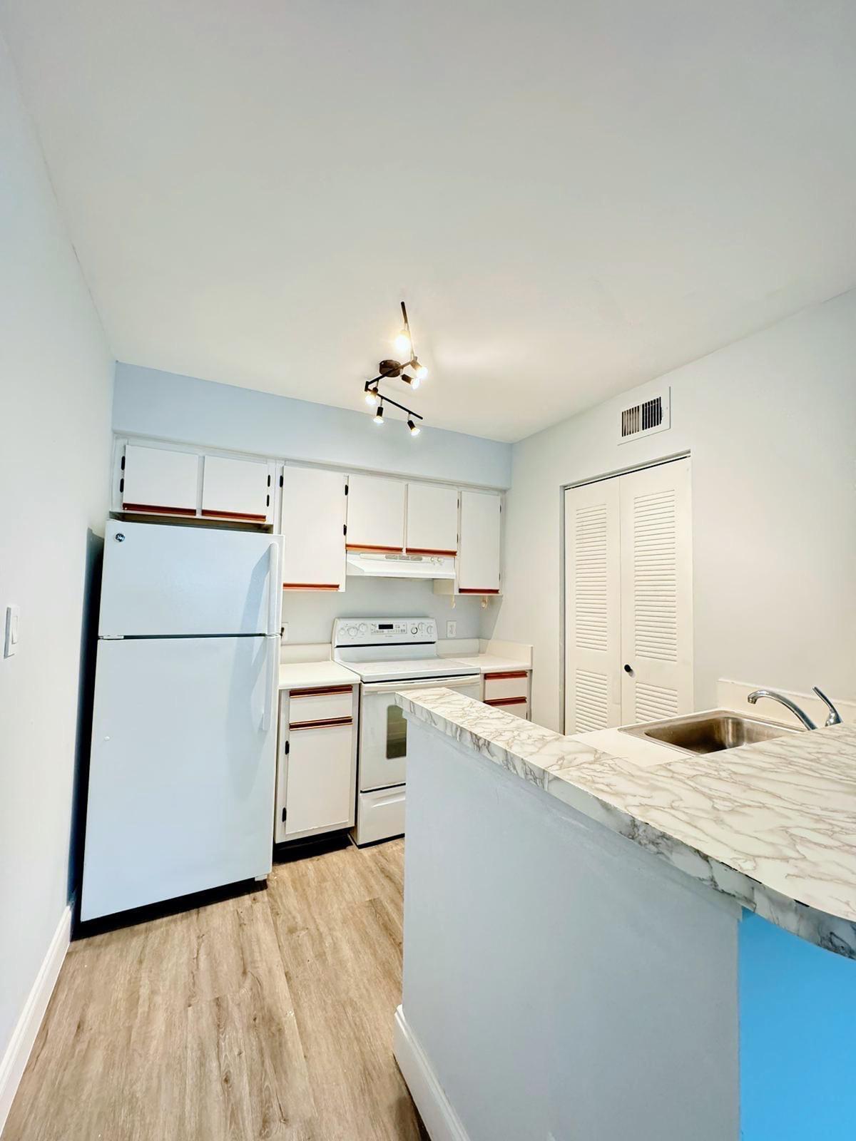 540 South Park Road Hollywood, FL 33021 - Photo 15 of 26 a kitchen with a sink refrigerator and cabinets