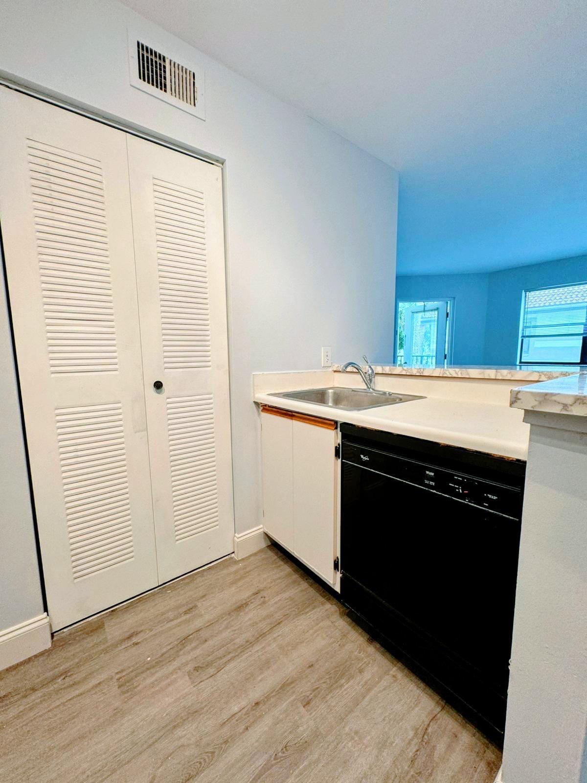 540 South Park Road Hollywood, FL 33021 - Photo 16 of 26 a kitchen with a sink and a refrigerator