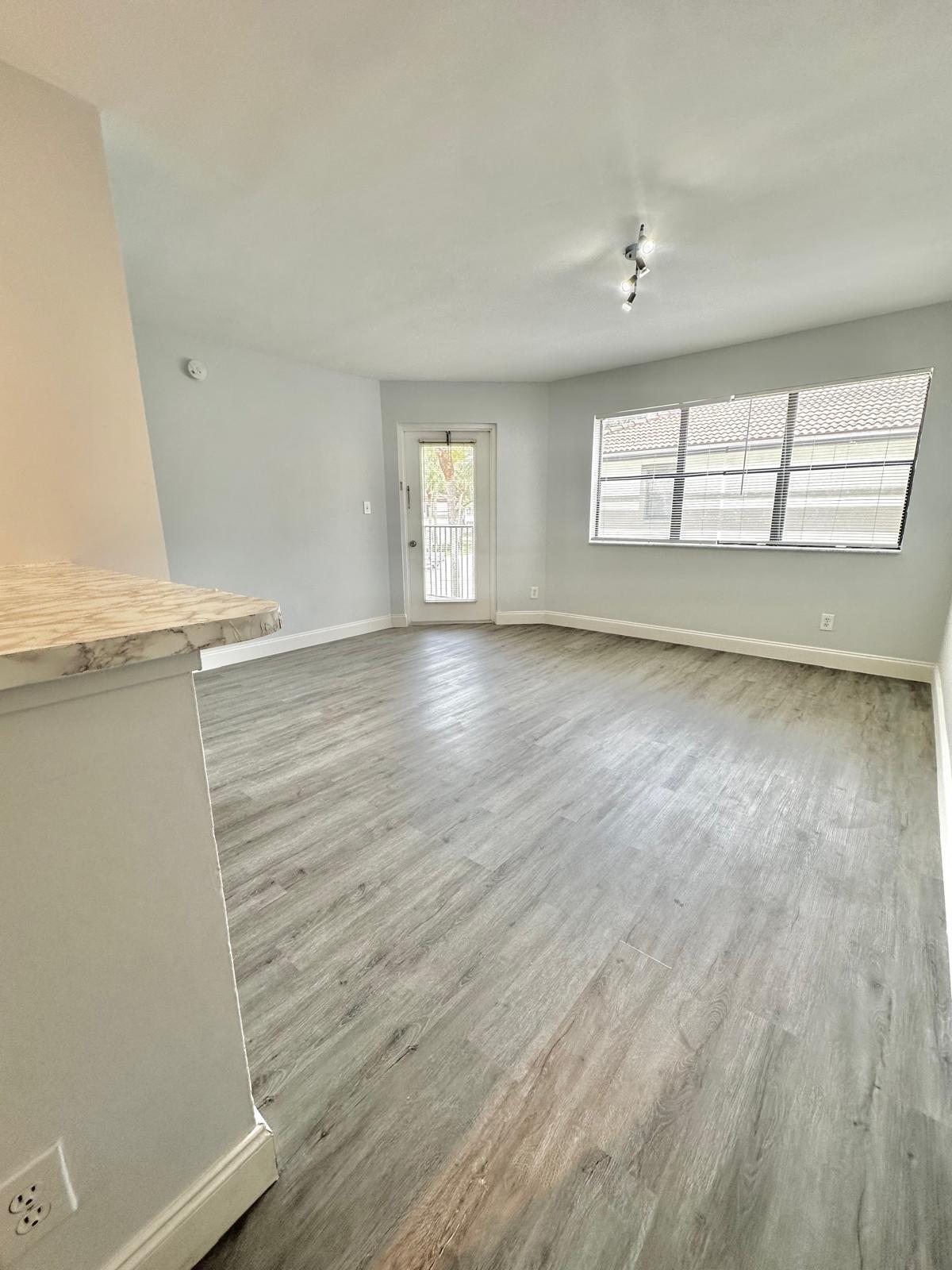 540 South Park Road Hollywood, FL 33021 - Photo 18 of 26 an empty room with wooden floor and windows