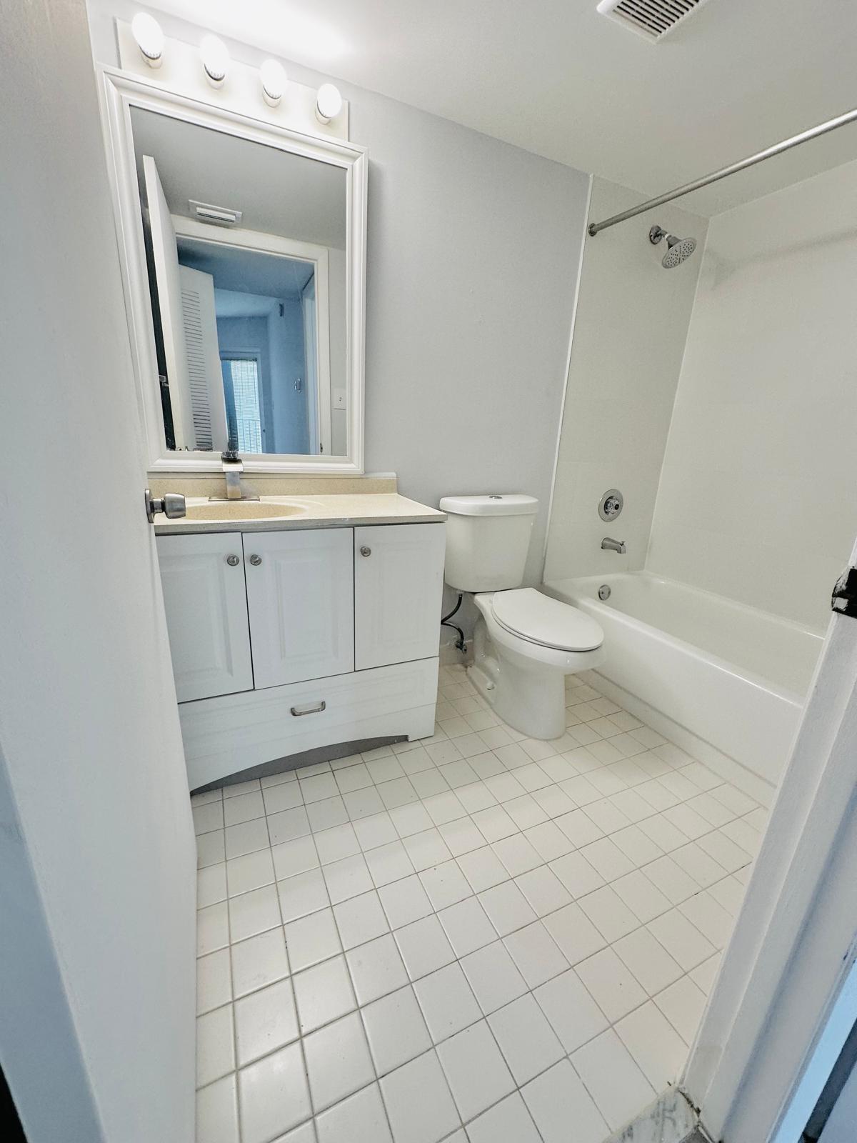 540 South Park Road Hollywood, FL 33021 - Photo 20 of 26 a bathroom with a toilet a sink and mirror