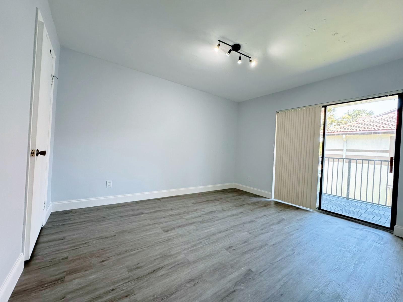540 South Park Road Hollywood, FL 33021 - Photo 21 of 26 a view of an empty room with wooden floor and a window