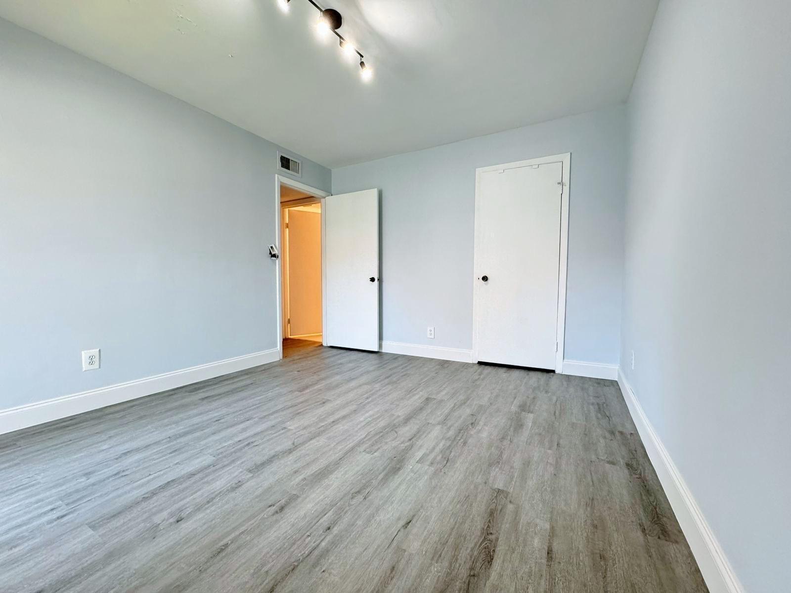540 South Park Road Hollywood, FL 33021 - Photo 22 of 26 a view of an empty room with wooden floor and a window